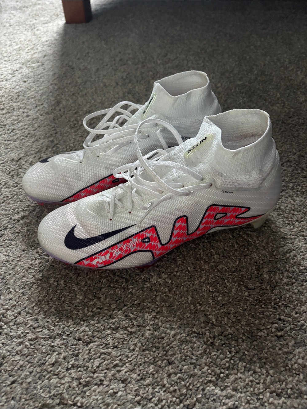 Nike White Soccer Cleats with Pink and Black Accents